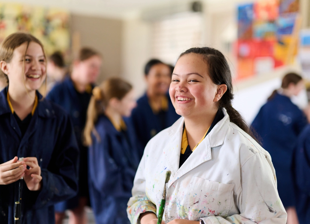 female-student-laughing-science-class