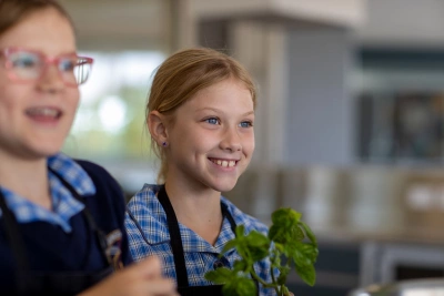 Smiling student in kitchen