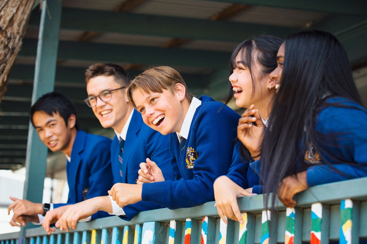 Students laughing on balcony