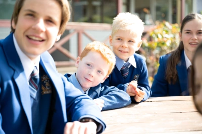 Primary and Secondary Students at Table